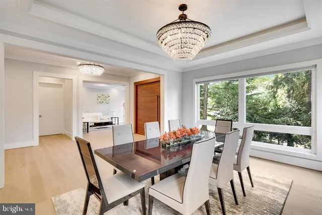 a living room with furniture and large windows