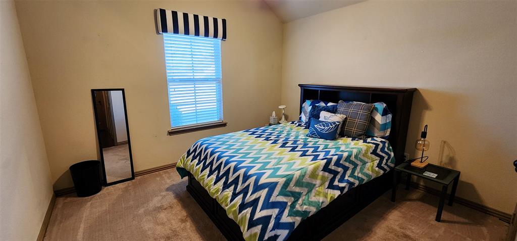 217 Heather Lane Decatur, TX 76234 - Photo 13 of 20 a bedroom with a bed and a closet