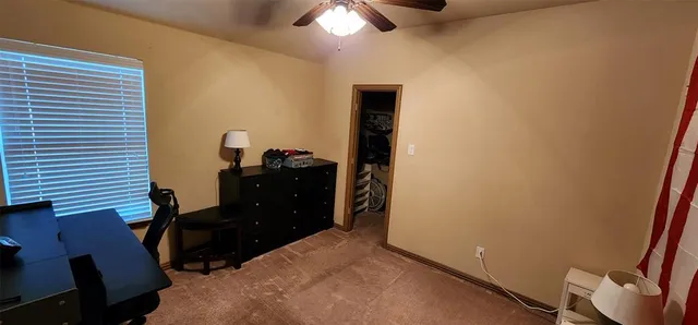 a bed room with a bed and a window