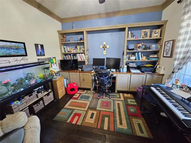 a room with furniture toys and a bookshelf