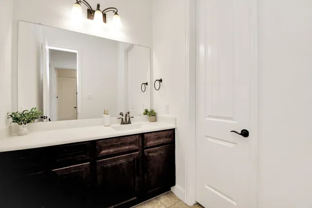 a bathroom with a white bath tub and a shower