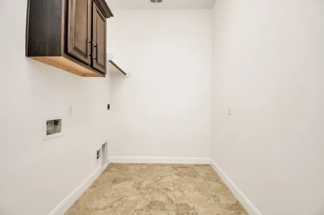 a view of a backyard with plants and sitting area