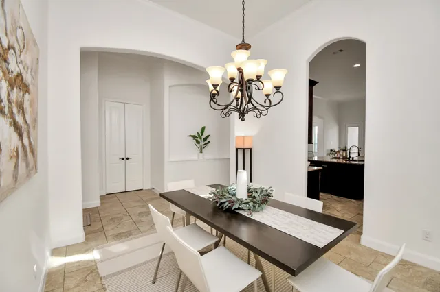a kitchen with sink stove and cabinets