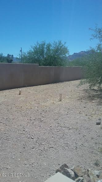 84 Altar Court Rio Rico, AZ 85648 - Photo 7 of 7 a view of wooden floor and mountains in the background