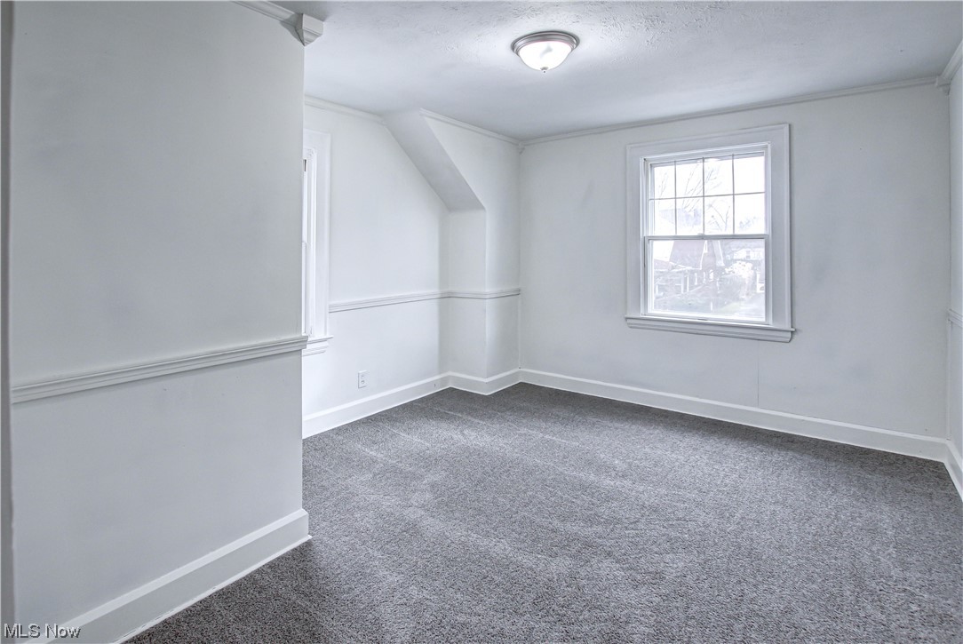 4764 Rockwood Road Cleveland, OH 44125 - Photo 15 of 35 Carpeted empty room with a textured ceiling