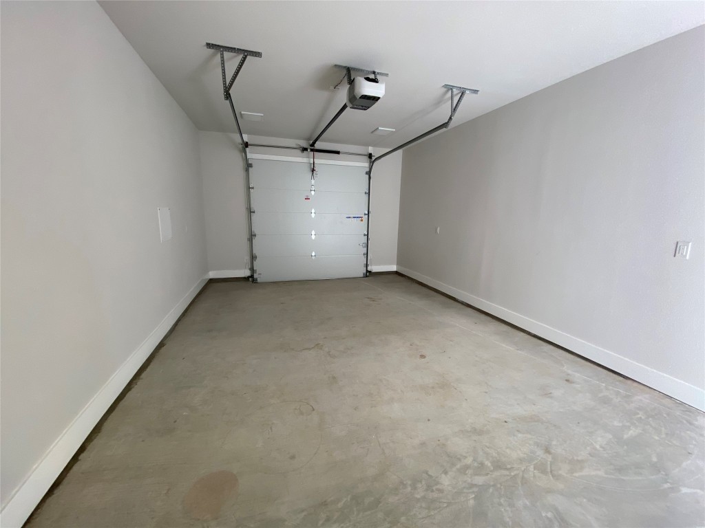 6920 Bethune Avenue, Unit 2 Austin, TX 78752 - Photo 13 of 20 Garage with baseboards and a garage door opener