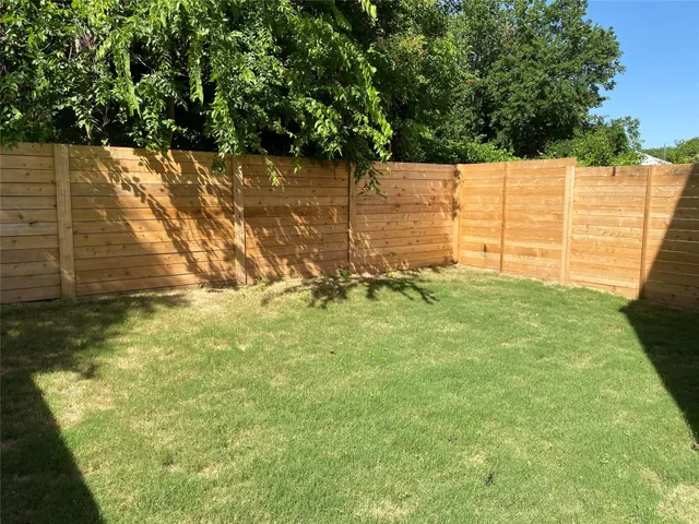 a view of yard with large tree