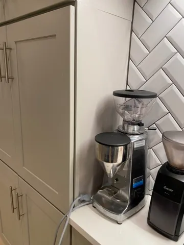 a view of storage and utility room with two washing machine