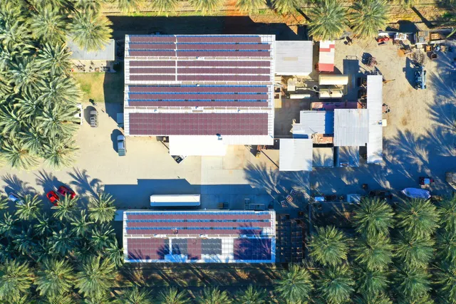 a view of a living room with furniture and a floor to ceiling window