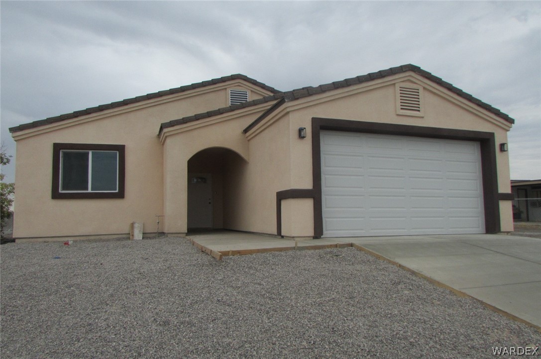 836 Ramar Road Bullhead City, AZ 86442 - Photo 2 of 10 a bathroom with a sink and a garage