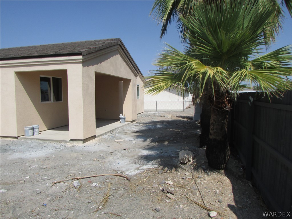 836 Ramar Road Bullhead City, AZ 86442 - Photo 8 of 10 a view of a palm tree in front of house