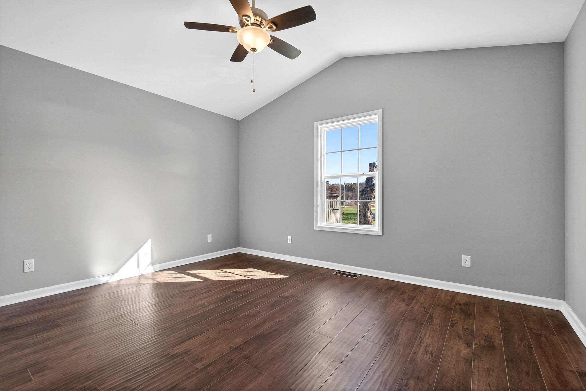 409 Buffalo Valley Road Baxter, TN 38544 - Photo 12 of 29 a view of an empty room with wooden floor and a window