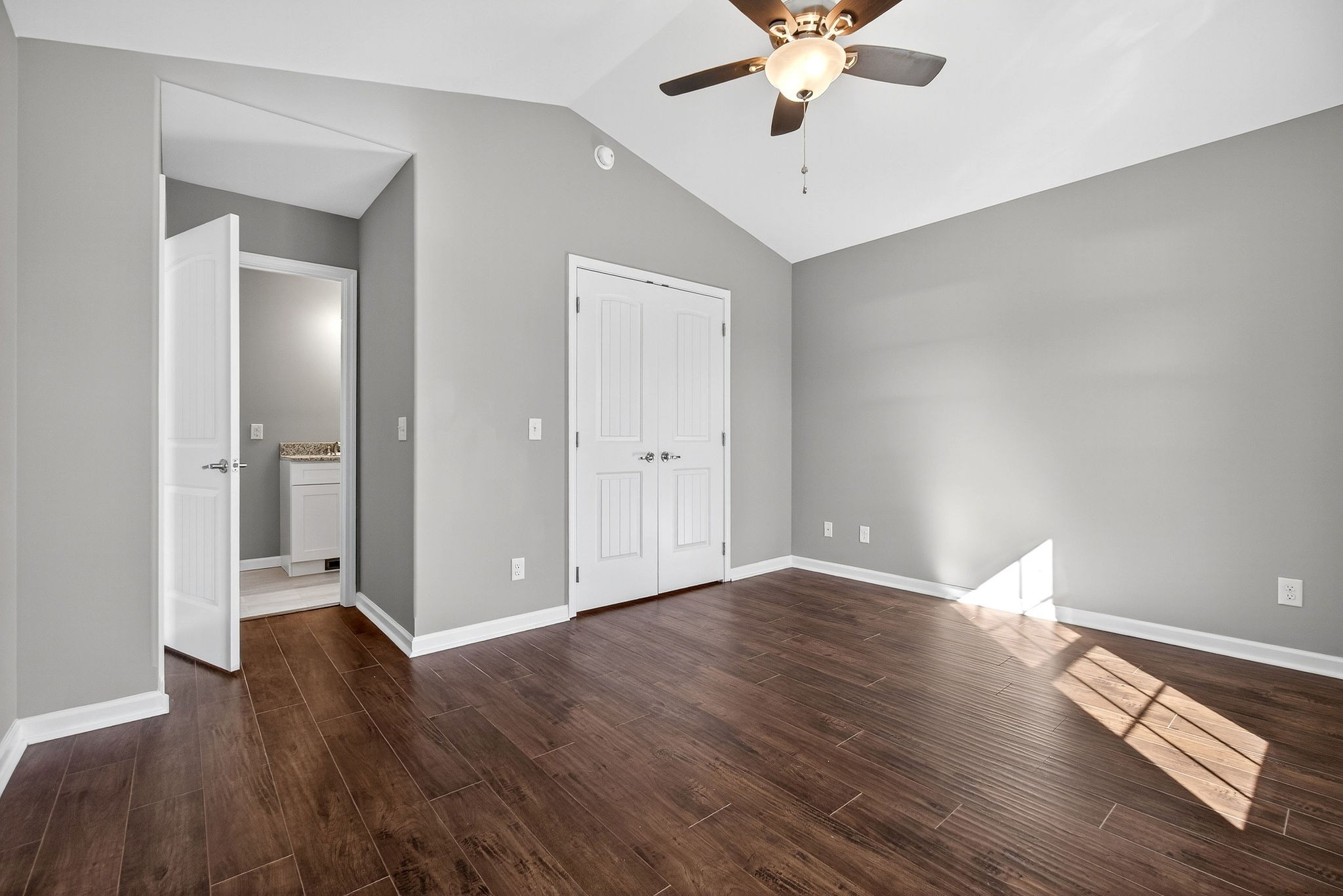 409 Buffalo Valley Road Baxter, TN 38544 - Photo 13 of 29 an empty room with wooden floor and fan