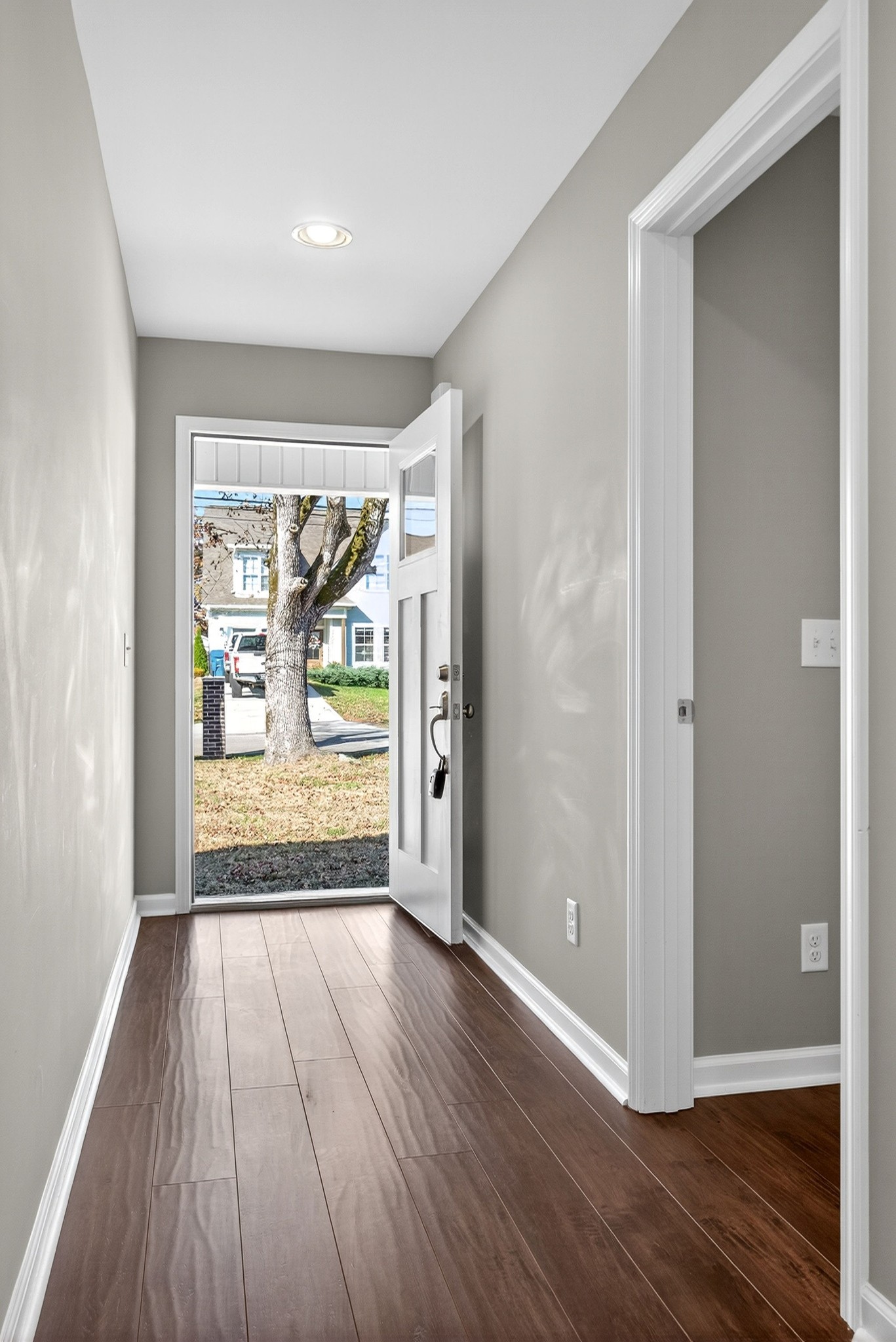 409 Buffalo Valley Road Baxter, TN 38544 - Photo 2 of 29 a view of an empty room with wooden floor and a window