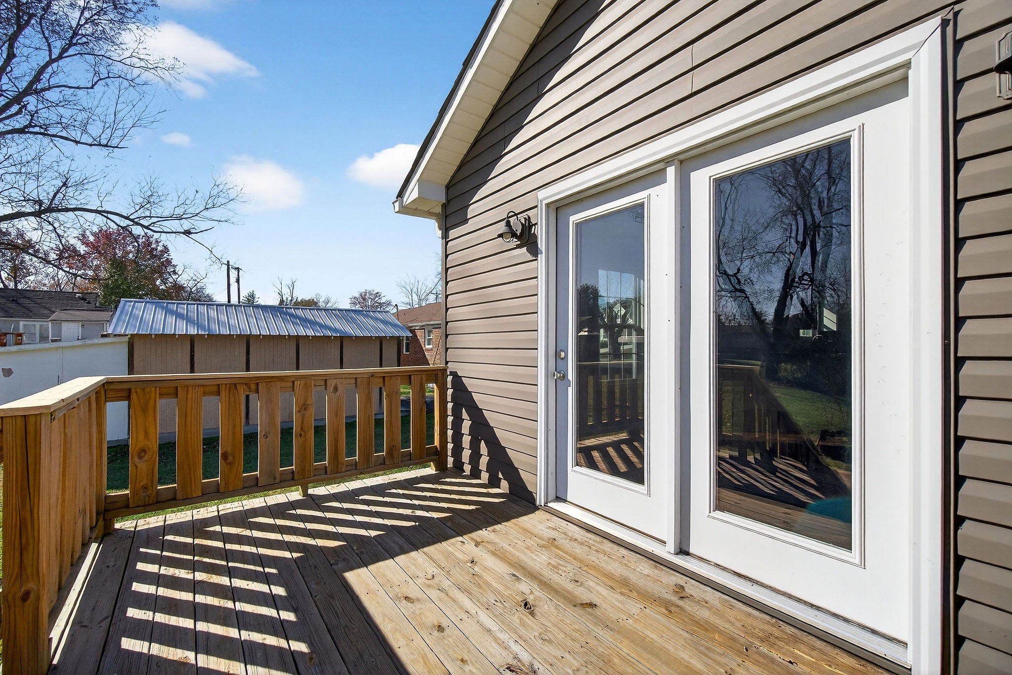 409 Buffalo Valley Road Baxter, TN 38544 - Photo 28 of 29 a view of a wooden balcony with a potted plants