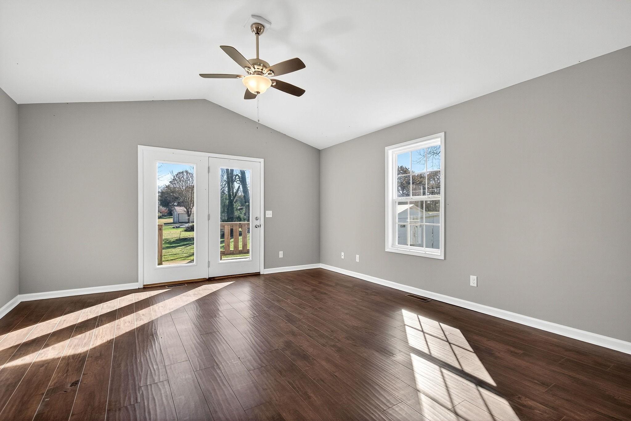 409 Buffalo Valley Road Baxter, TN 38544 - Photo 8 of 29 a view of an empty room with a window and wooden floor