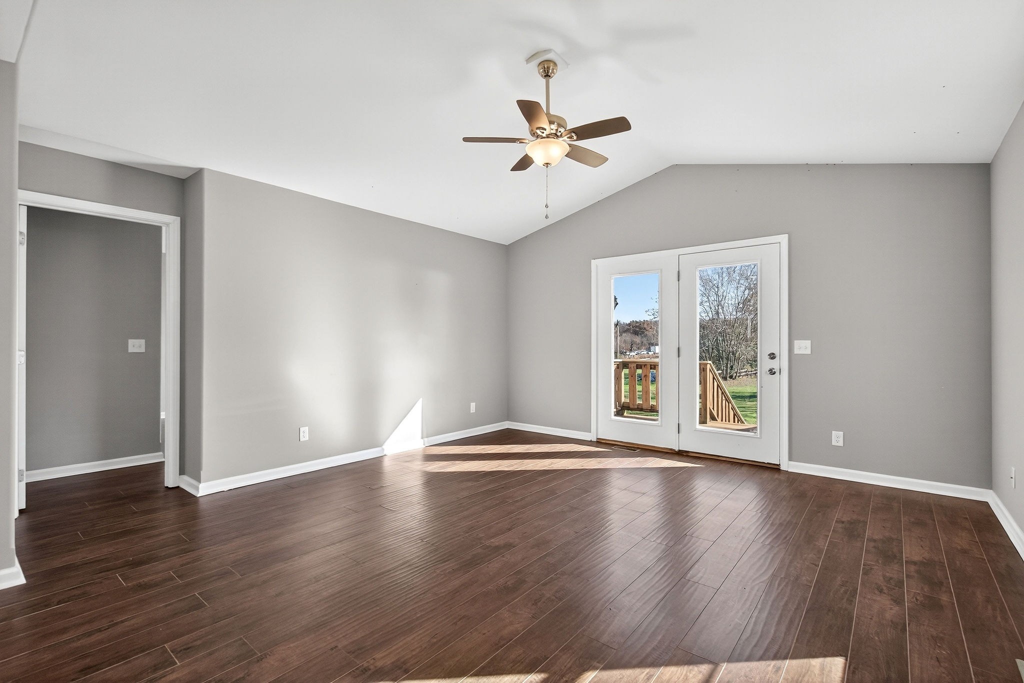 409 Buffalo Valley Road Baxter, TN 38544 - Photo 9 of 29 a view of an empty room with wooden floor and a window