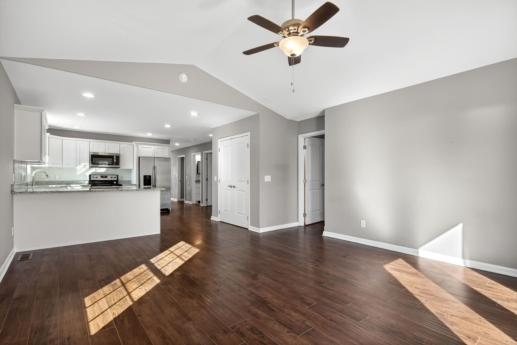409 Buffalo Valley Road Baxter, TN 38544 - Photo 10 of 29 a view of a kitchen with wooden floor and a ceiling fan