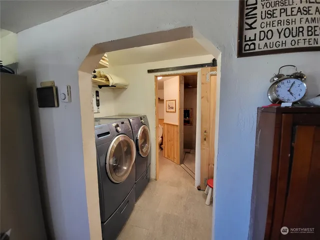 a utility room with dryer and washer