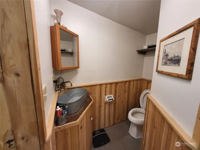 a bathroom with a toilet and a sink