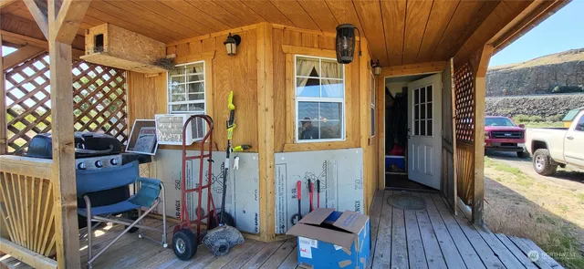 a view of a house with wooden floor and a dining table
