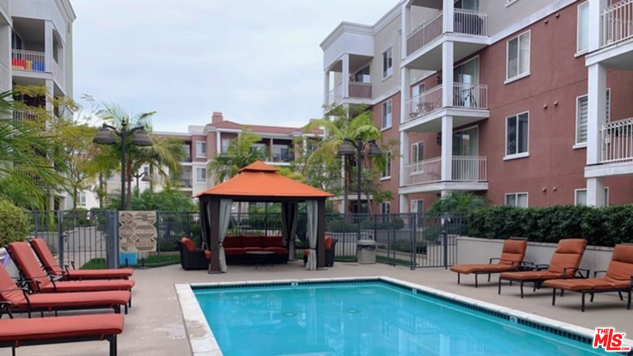 a view of pool with outdoor seating