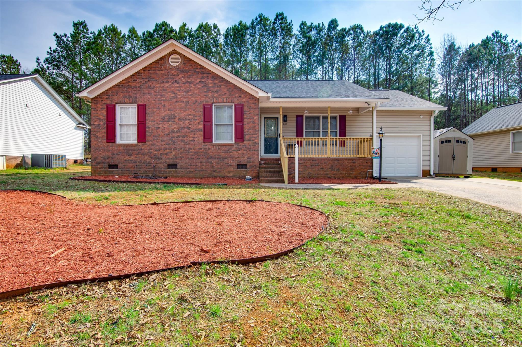 806 East Ridge Street Kings Mountain, NC 28086 - Photo 1 of 38 a front view of a house with a yard