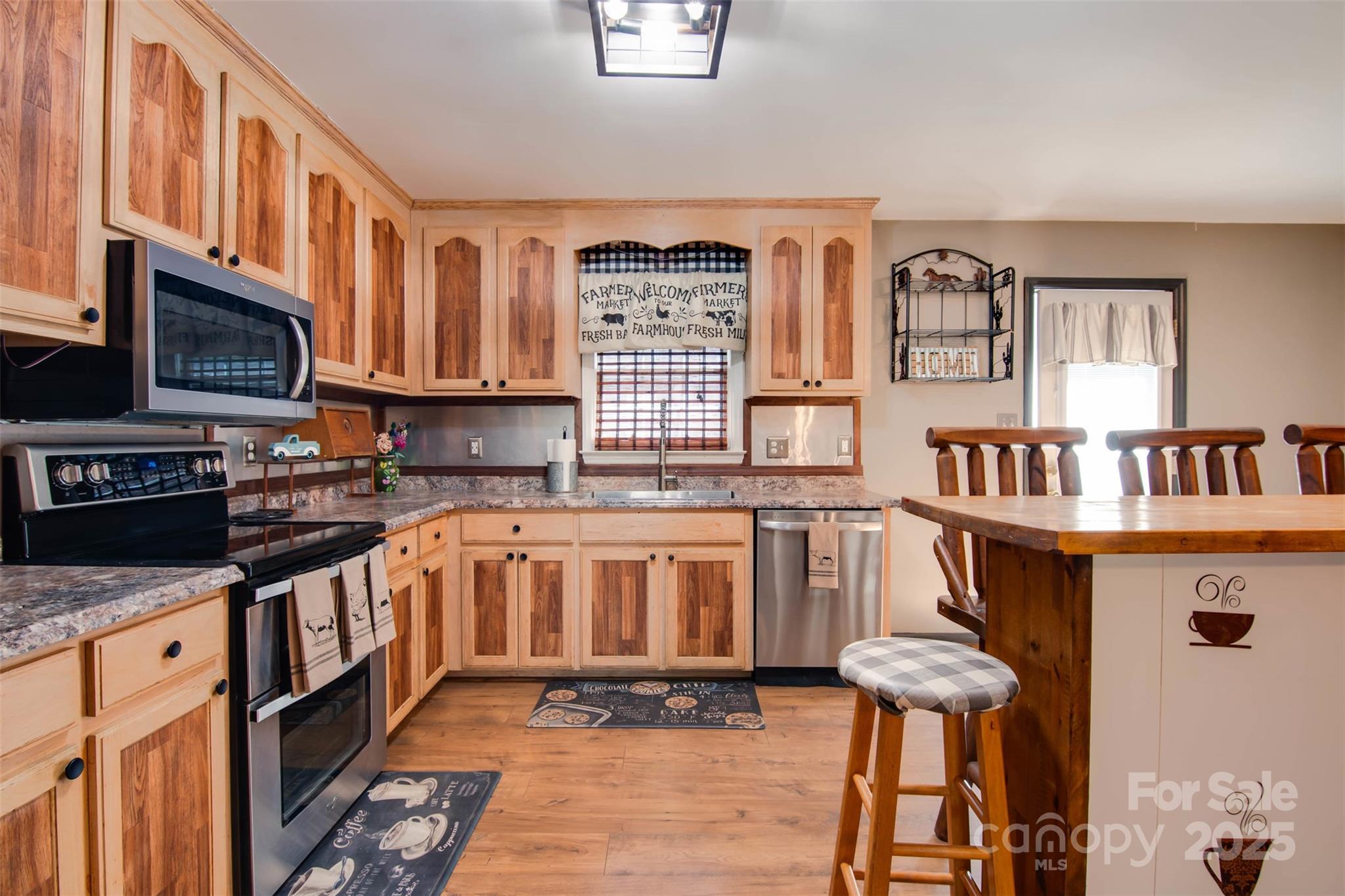 806 East Ridge Street Kings Mountain, NC 28086 - Photo 3 of 38 a kitchen with a stove a sink and a refrigerator