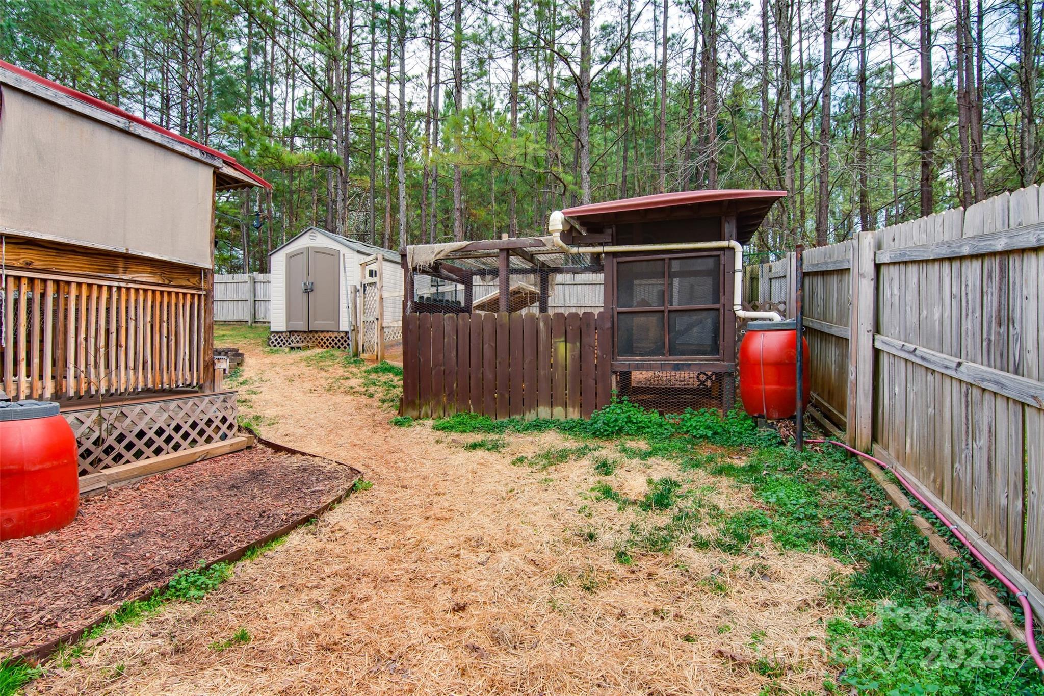 806 East Ridge Street Kings Mountain, NC 28086 - Photo 31 of 38 a view of backyard with wooden fence and large trees