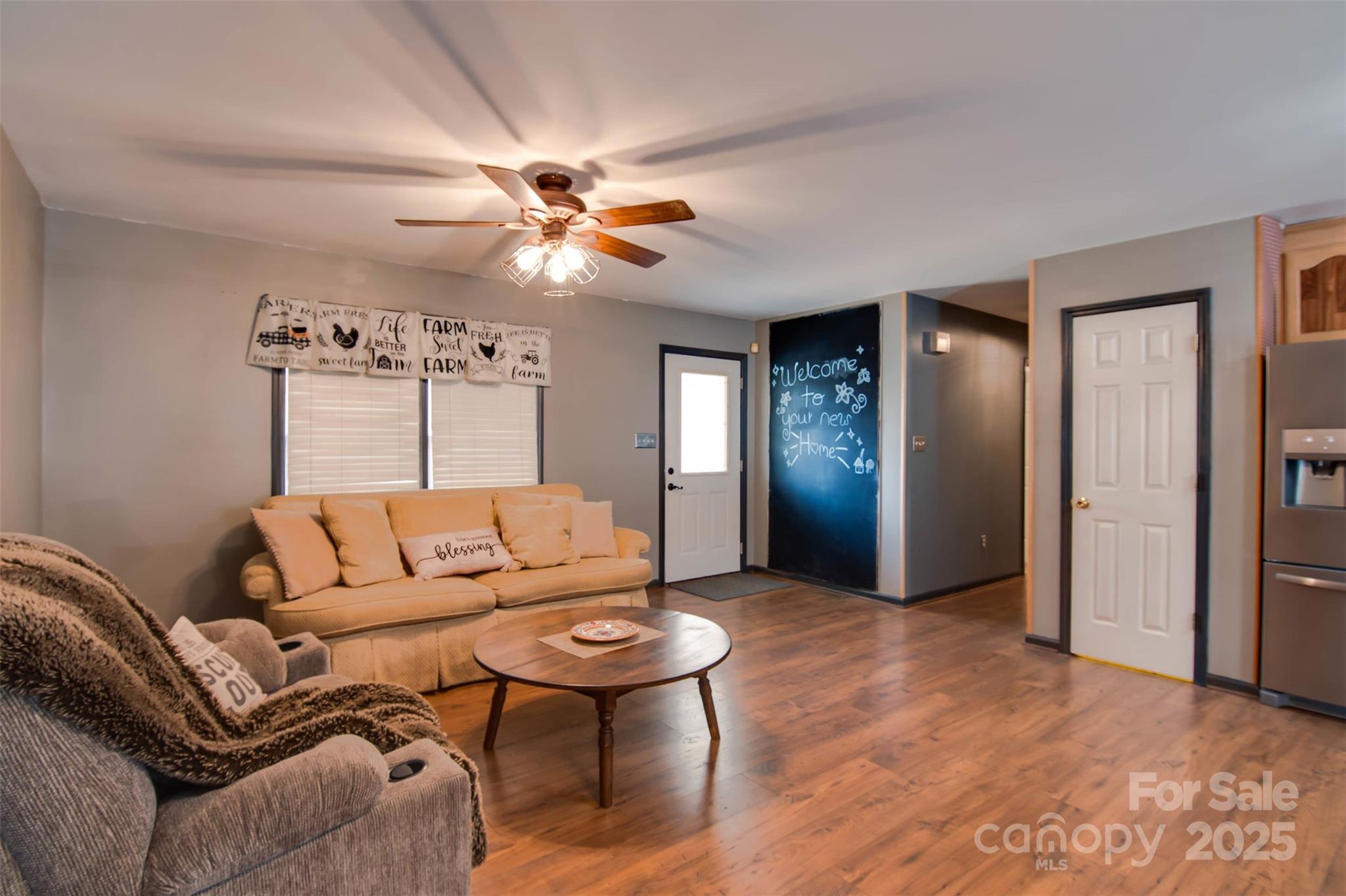 806 East Ridge Street Kings Mountain, NC 28086 - Photo 10 of 38 a living room with furniture a ceiling fan and a rug