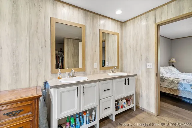 a spacious bathroom with a double vanity sink and a mirror