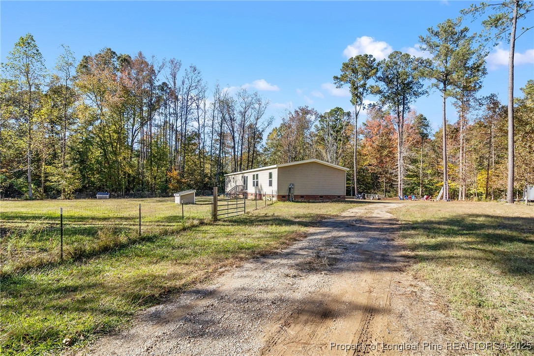 7096 Monarch Drive Linden, NC 28356 - Photo 2 of 31 a view of a house with a yard