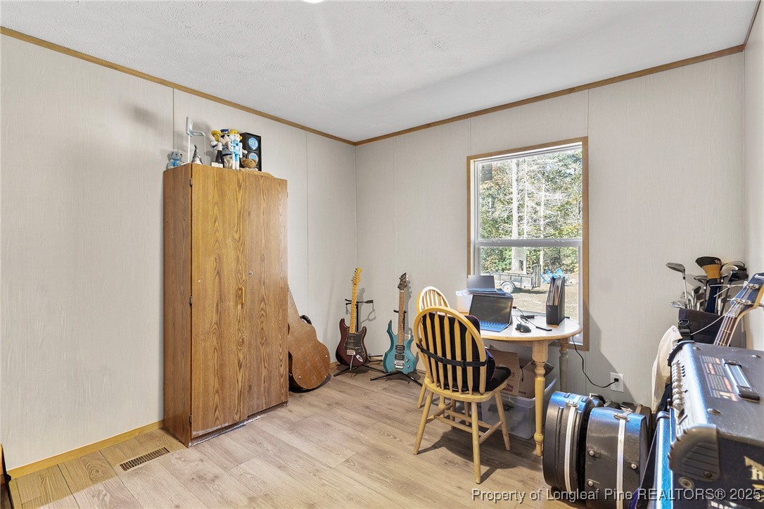 7096 Monarch Drive Linden, NC 28356 - Photo 22 of 31 a view of a workspace with furniture and a window