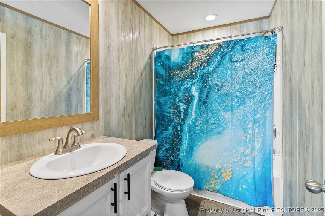 7096 Monarch Drive Linden, NC 28356 - Photo 24 of 31 a bathroom with a sink and a mirror