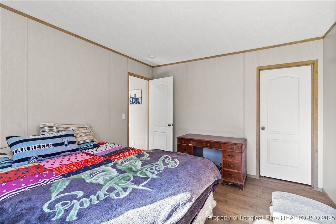 7096 Monarch Drive Linden, NC 28356 - Photo 28 of 31 a bedroom with a bed and a dresser in it