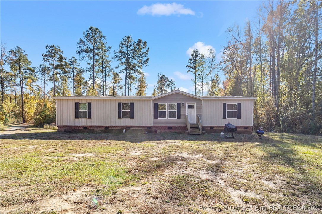 7096 Monarch Drive Linden, NC 28356 - Photo 4 of 31 a view of a house with a yard