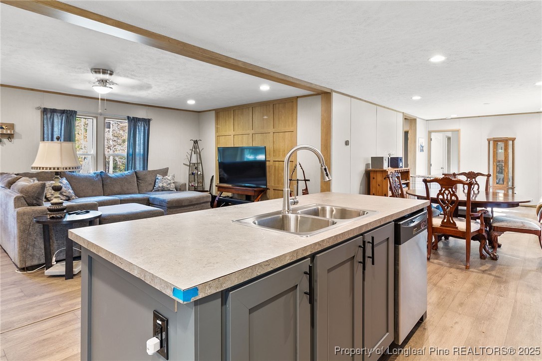 7096 Monarch Drive Linden, NC 28356 - Photo 10 of 31 a view of kitchen island a sink and living room