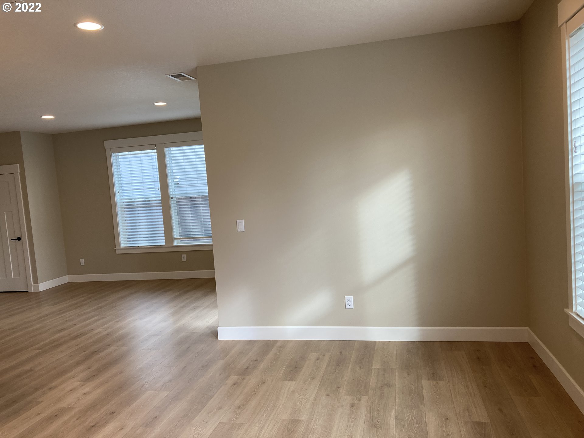 7415 South 13th Street Ridgefield, WA 98642 - Photo 13 of 28 an empty room with wooden floor and windows