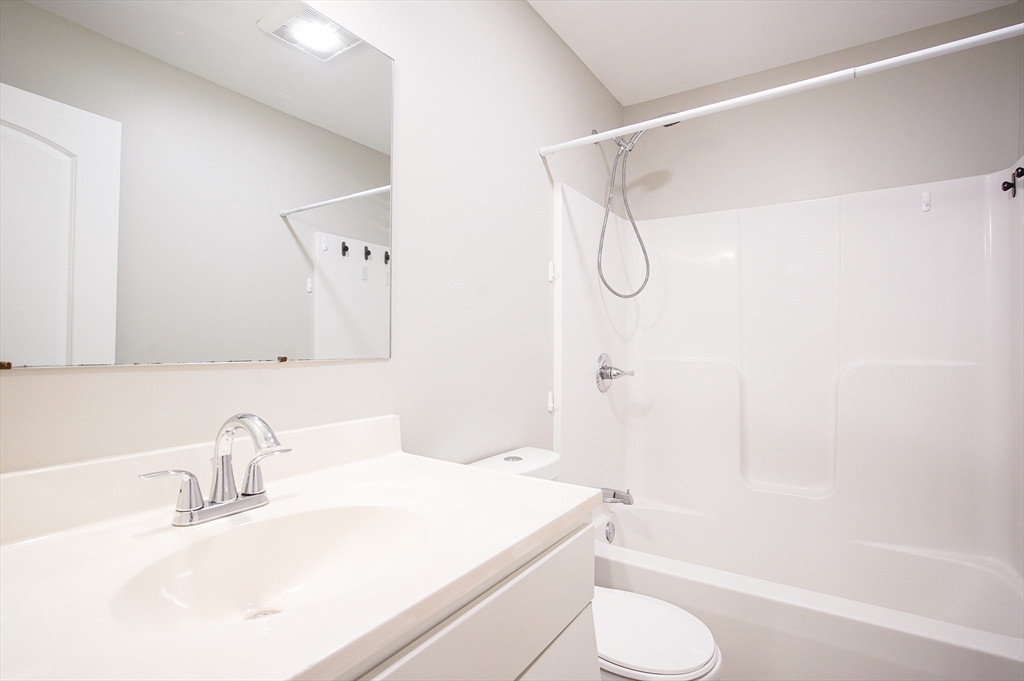 18-20 Healey Street, Unit 20 Springfield, MA 01151 - Photo 8 of 14 a bathroom with a sink toilet and shower