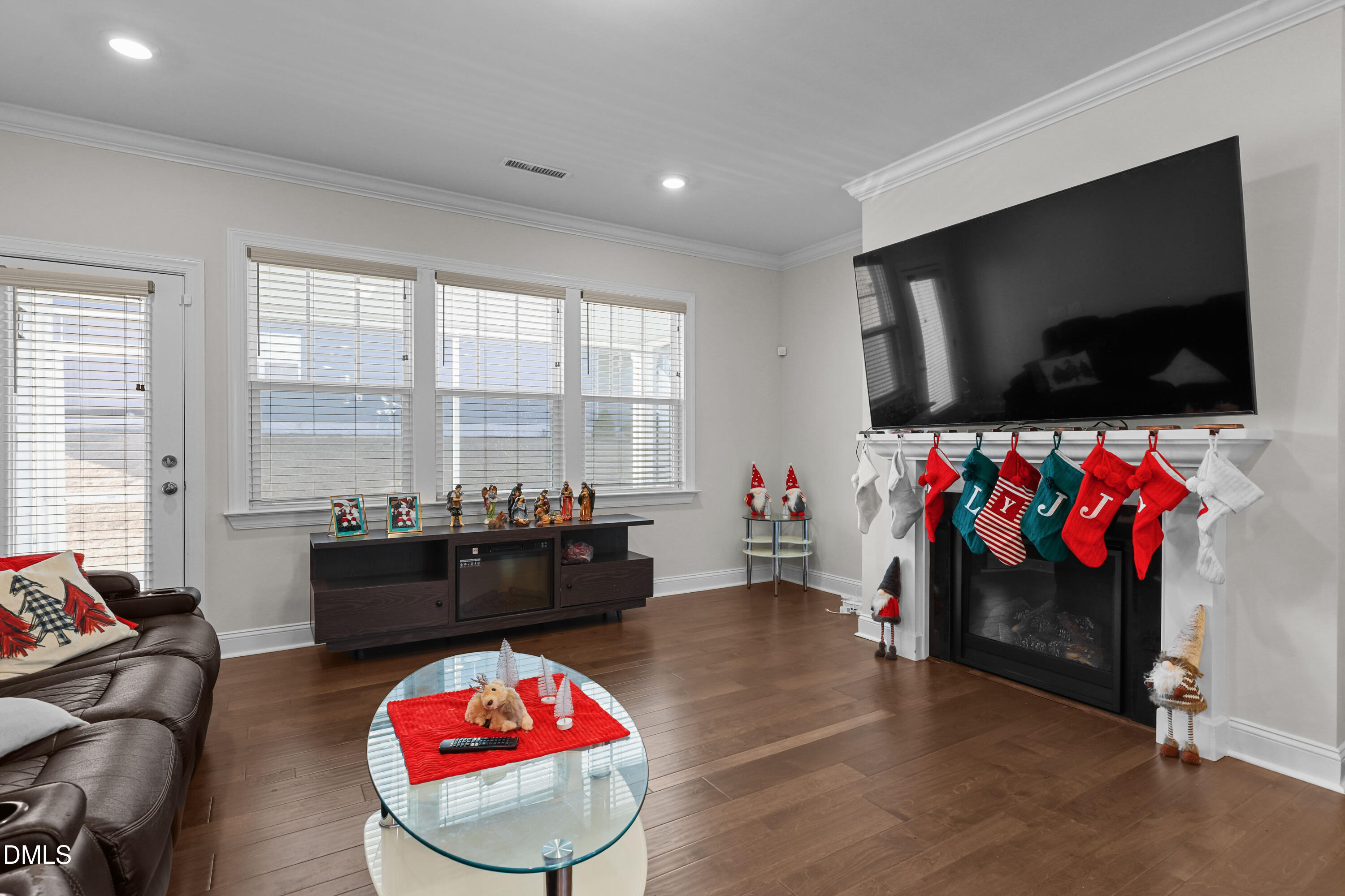 6117 Balance Court Raleigh, NC 27616 - Photo 12 of 44 a living room with furniture and a flat screen tv