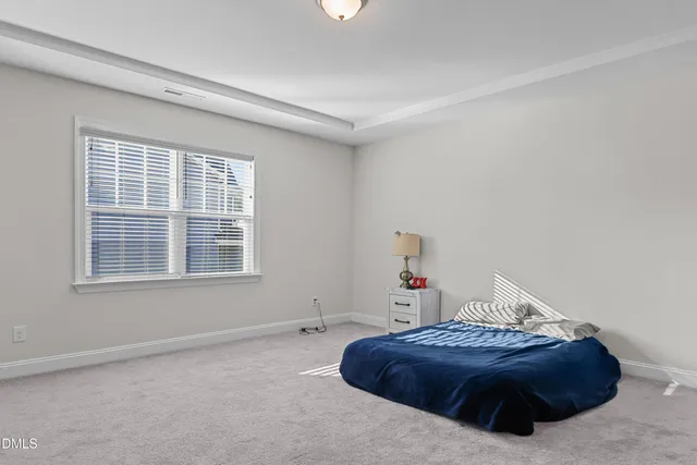 a room with a bed and a window