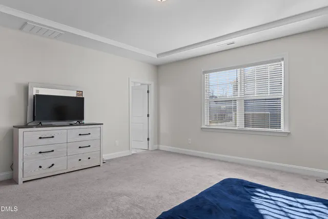 a room with furniture and flat screen tv