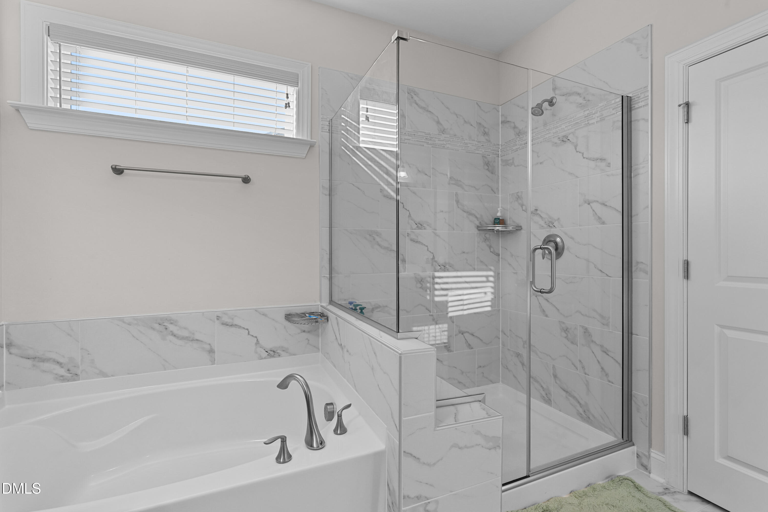 6117 Balance Court Raleigh, NC 27616 - Photo 28 of 44 a bathroom with a bathtub and shower