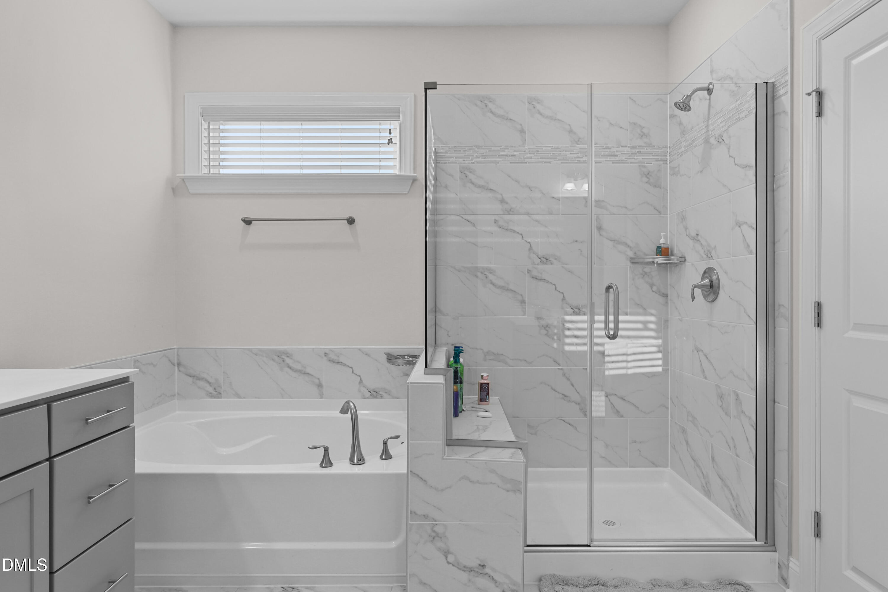 6117 Balance Court Raleigh, NC 27616 - Photo 29 of 44 a bathroom with a bathtub and a shower