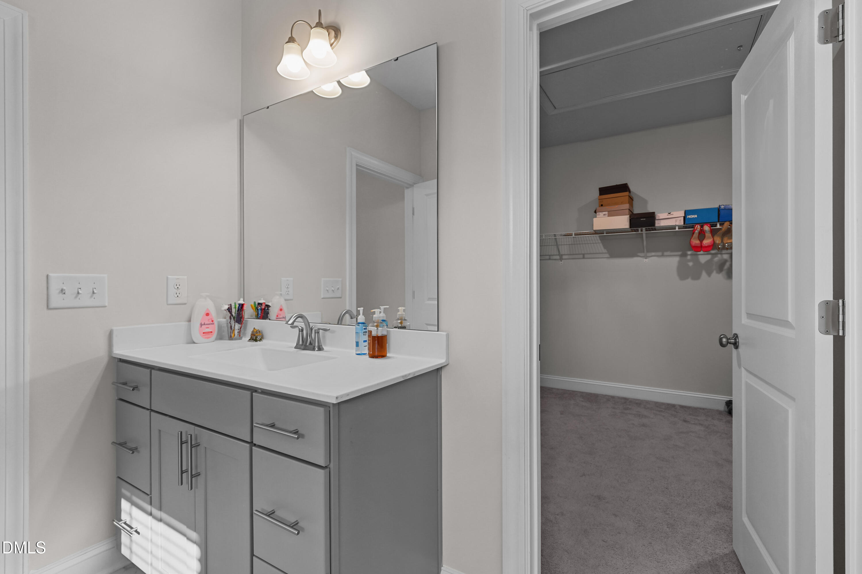 6117 Balance Court Raleigh, NC 27616 - Photo 30 of 44 a view of cabinets a sink and dishwasher in a bathroom