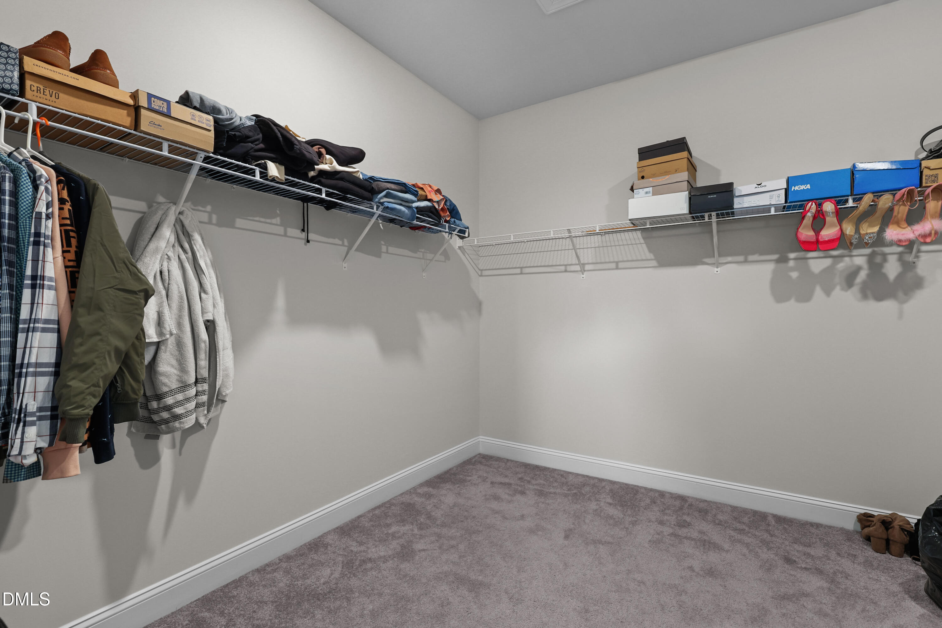 6117 Balance Court Raleigh, NC 27616 - Photo 31 of 44 a view of walk in closet with clothes and shoes
