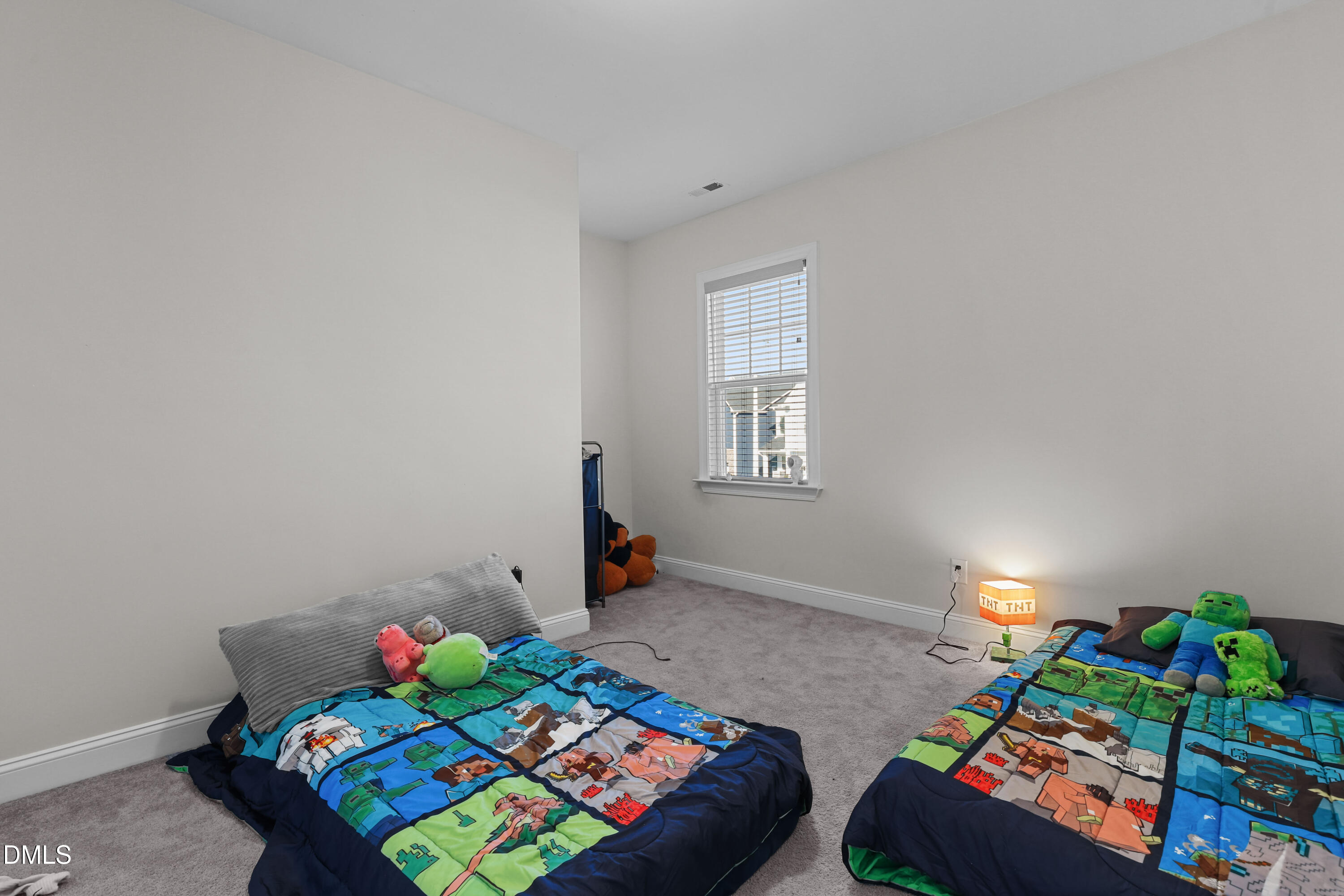 6117 Balance Court Raleigh, NC 27616 - Photo 34 of 44 a bedroom with bed and a window