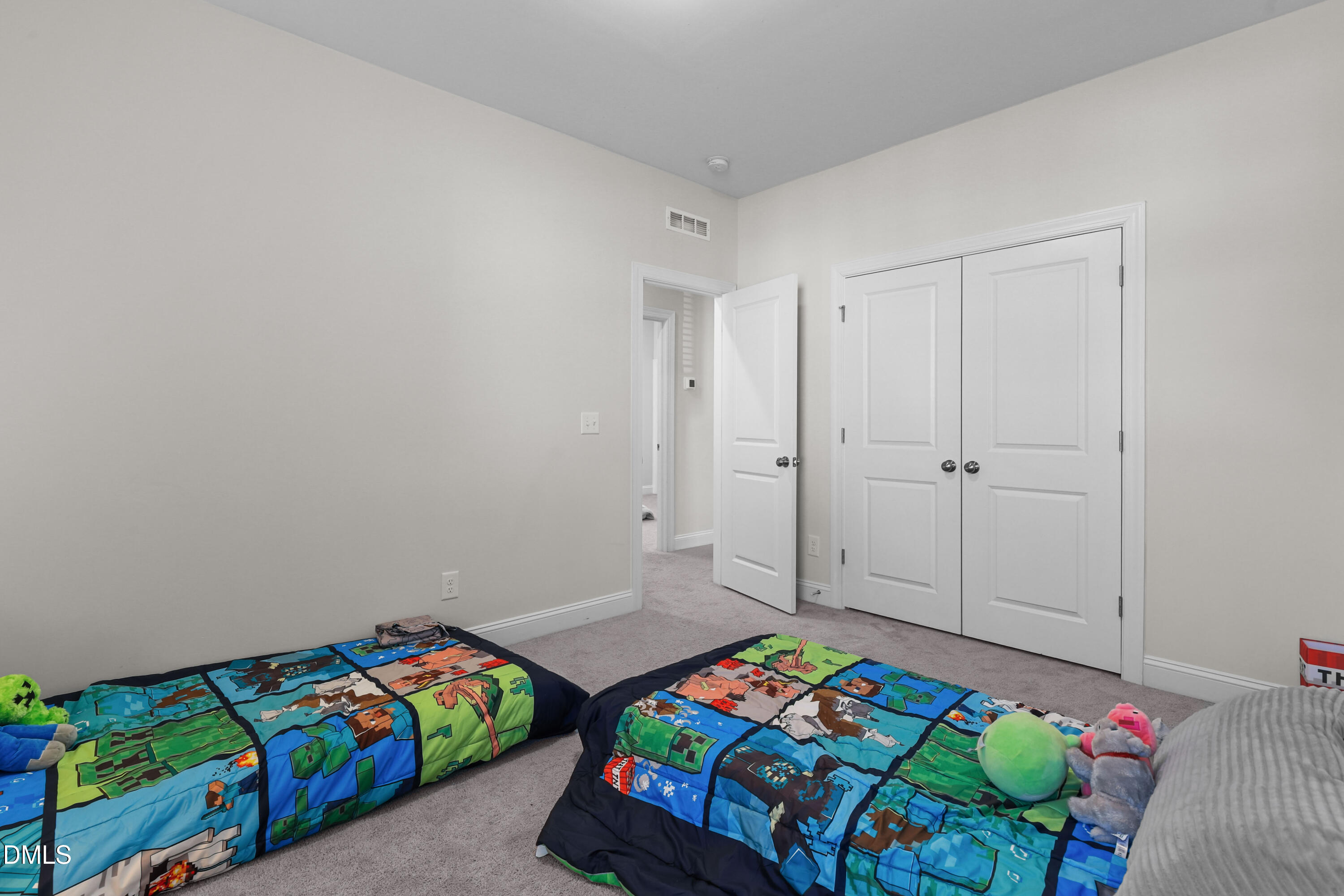 6117 Balance Court Raleigh, NC 27616 - Photo 35 of 44 a bedroom with a bed and a dresser in it