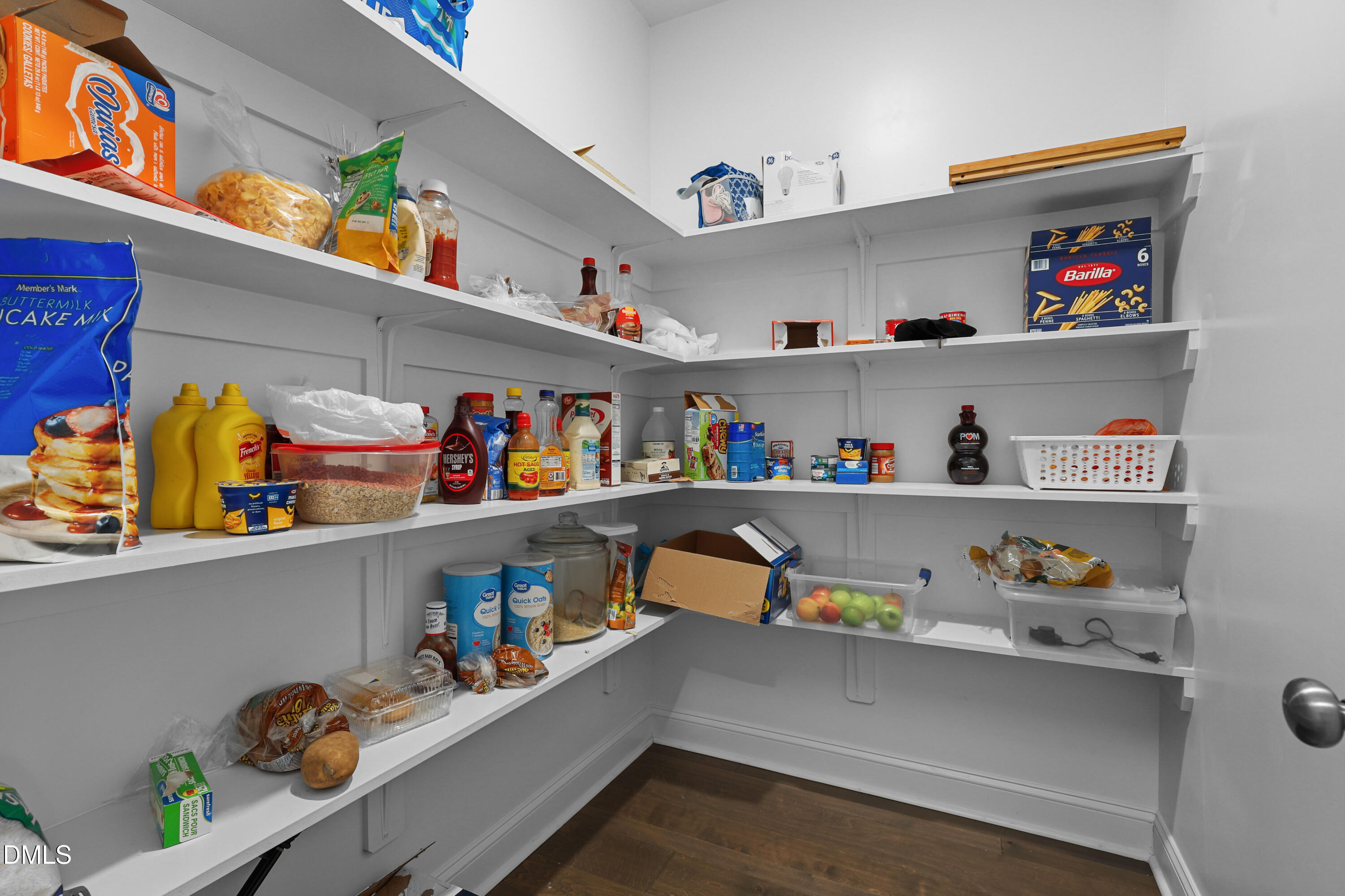 6117 Balance Court Raleigh, NC 27616 - Photo 10 of 44 a cabinet with food and a sink with lots of clutter