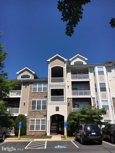 502 Sunset View Terrace Southeast, Unit 302 Leesburg, VA 20175 - Photo 1 of 50 Beautiful building with stonework on front.